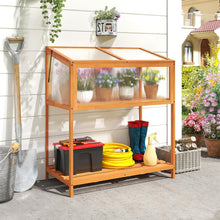 Load image into Gallery viewer, Wooden garden storage rack with plants, tools, and boots outdoors.